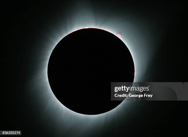 The sun is is in full eclipse over Grand Teton National Park on August 21, 2017 outside Jackson, Wyoming. Thousands of people have flocked to the...