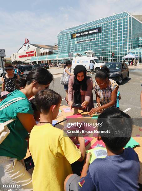 Attendees build pinhole eclipse viewers on August 21, 2017 at the Cradle of Aviation Museum in Garden City, New York. Millions of people have flocked...