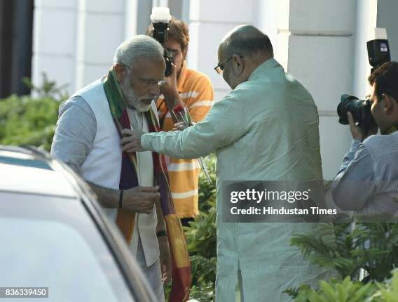 National BJP President Amit Shah welcomes PM Narendra Modi during a meeting with BJP Chief Ministers at BJP office on August 21, 2017 in New Delhi,...