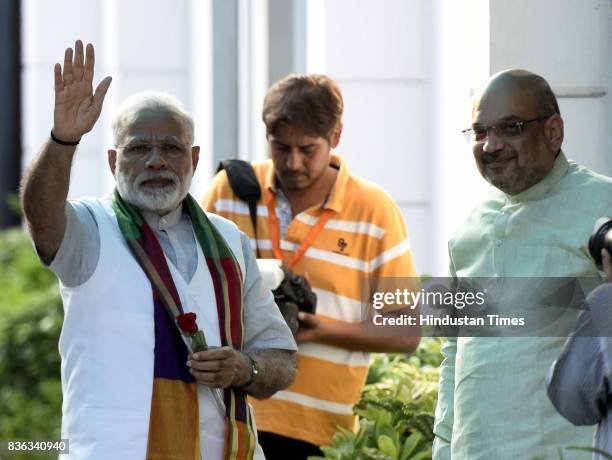 President Amit Shah welcomes Prime Minister Narendra Modi at the party's Mukhyamatri Parishad Baithak on August 21, 2017 in New Delhi, India.