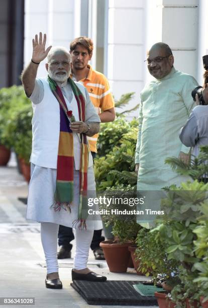 President Amit Shah welcomes Prime Minister Narendra Modi at the party's Mukhyamatri Parishad Baithak on August 21, 2017 in New Delhi, India.