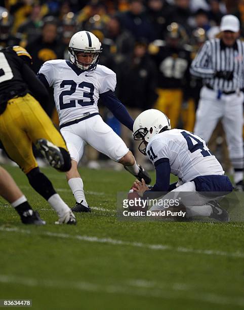 Kicker Kevin Kelly of the Penn State Nittany Lions kicks a field goal as Jeremy Boone holds the ball on the play against the Iowa Hawkeyes at Kinnick...