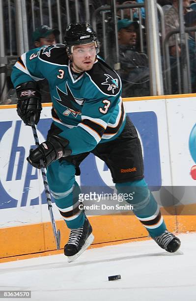 Douglas Murray of the San Jose Sharks skates up ice with the puck during an NHL game against the St. Louis Blues on November 6, 2008 at HP Pavilion...