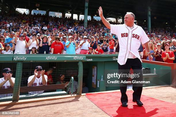 Longtime NESN broadcaster and former Boston Red Sox second baseball Jerry Remy enters the fielf for a ceremony honoring his thirty years in the...