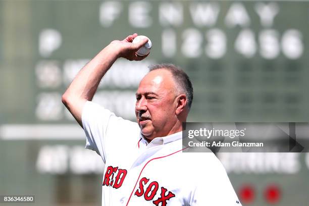 Longtime NESN broadcaster and former Boston Red Sox second baseball Jerry Remy throws a ceremonial first pitch during a ceremony honoring his thirty...