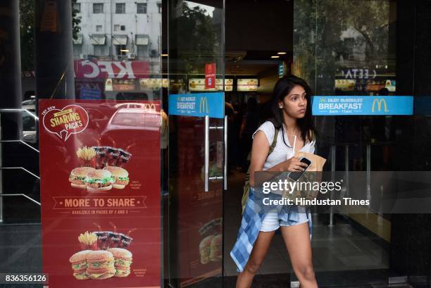 People eating at McDonald's outlet at Connaught Place on August 21, 2017 in New Delhi, India. McDonald's snapped its franchise agreement with...