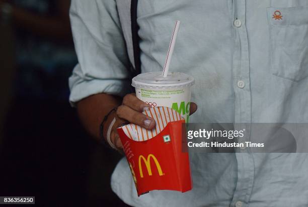 People eating at McDonald's outlet at Connaught Place on August 21, 2017 in New Delhi, India. McDonald's snapped its franchise agreement with...