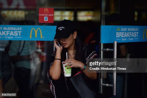 People eating at McDonald's outlet at Connaught Place on August 21, 2017 in New Delhi, India. McDonald's snapped its franchise agreement with...