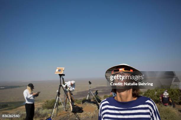 Locals and travelers from around the world gather on Menan Butte to watch the eclipse on August 21, 2017 in Menan, Idaho. Millions of people have...