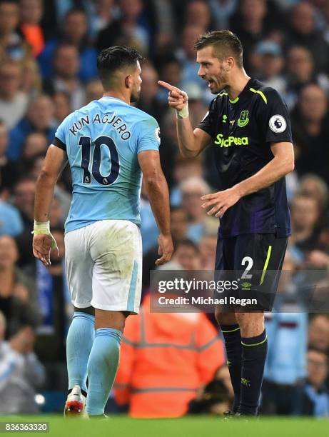 Morgan Schneiderlin of Everton and Sergio Aguero of Manchester City square up after Morgan Schneiderlin of Everton is shown a red card during the...