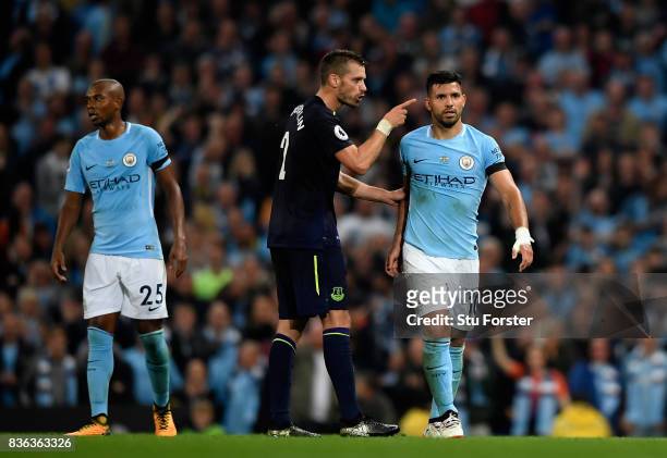 Morgan Schneiderlin of Everton and Sergio Aguero of Manchester City square up after Morgan Schneiderlin of Everton is shown a red card during the...
