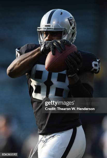 Clive Walford of the Oakland Raiders warms up during pregame warm ups prior to playing the Los Angeles Rams in an NFL preseason football game at...