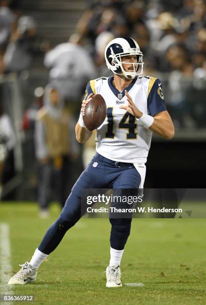 Sean Mannion of the Los Angeles Rams drops back to pass against the Oakland Raiders during the fourth quarter of their preseason NFL football game at...