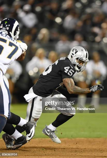 George Atkinson of the Oakland Raiders carries the ball against the Los Angeles Rams during the fourth quarter of their preseason NFL football game...