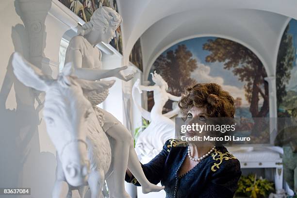 Italian actress Gina Lollobrigida is seen in her house next to her sculpture on October 14, 2008 in Rome, Italy.