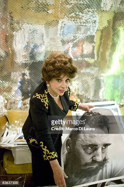 Italian actress Gina Lollobrigida is seen in her house as she shows a photograph she took of Fidel Castro on October 14, 2008 in Rome, Italy.