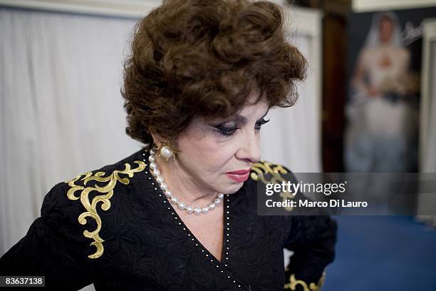 Italian actress Gina Lollobrigida is seen in the atelier of the Italian couturier Fausto Sarli as she tries on same dresses on October 14, 2008 in...