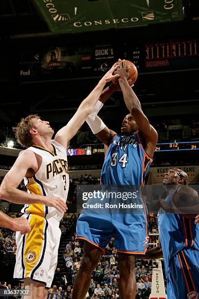 Desmond Mason of the Oklahoma City Thunder shoots over Troy Murphy of the Indiana Pacers at Conseco Fieldhouse on November 10, 2008 in Indianapolis,...
