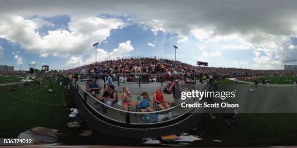 People watch the solar eclipse at Saluki Stadium on the campus of Southern Illinois University on August 21, 2017 in Carbondale, Illinois. Although...