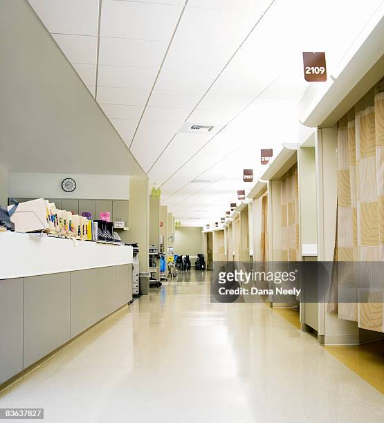 outpatient desk & empty hospital corridor - hospital curtain stock pictures, royalty-free photos & images
