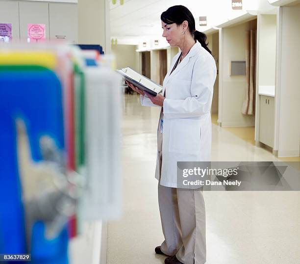 Checking Chart Notes 4,055 Doctor Checking Chart Stock Photos, High-Res Pictures, and Images ...