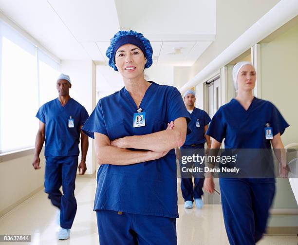 surgical team in hospital corridor, motion blur - nurse full length stock pictures, royalty-free photos & images