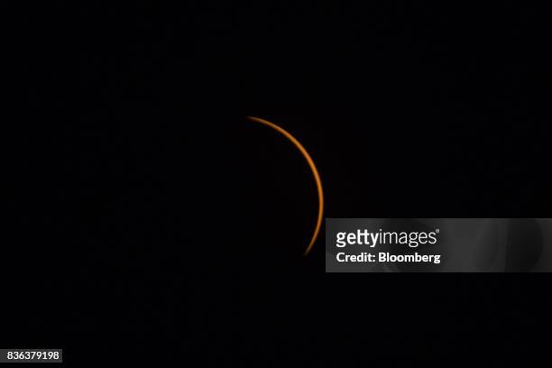 The moon moves in front of the sun after totality during a solar eclipse viewed from the campus of Southern Illinois University in Carbondale,...