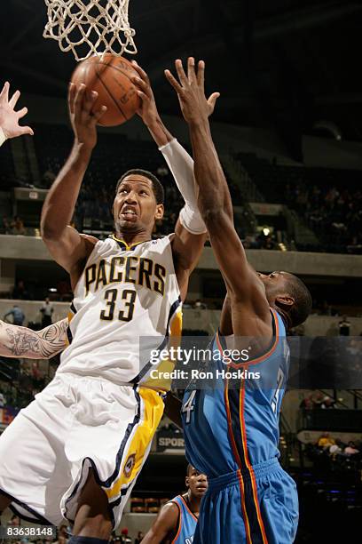 Danny Granger of the Indiana Pacers drives past Kevin Durant of the Oklahoma City Thunder at Conseco Fieldhouse on November 10, 2008 in Indianapolis,...