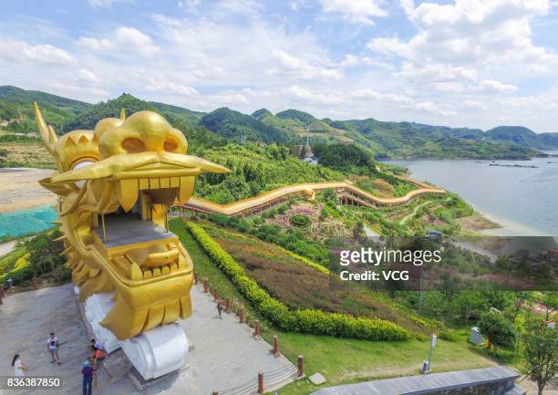 Meter-long dragon shaped corridor stretches along the Feilong Lake on August 19, 2017 in Zunyi, Guizhou Province of China. A 8-meter-wide,...
