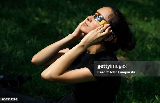 People view the solar eclipse at Battery Park on August 21, 2017 in New York City.