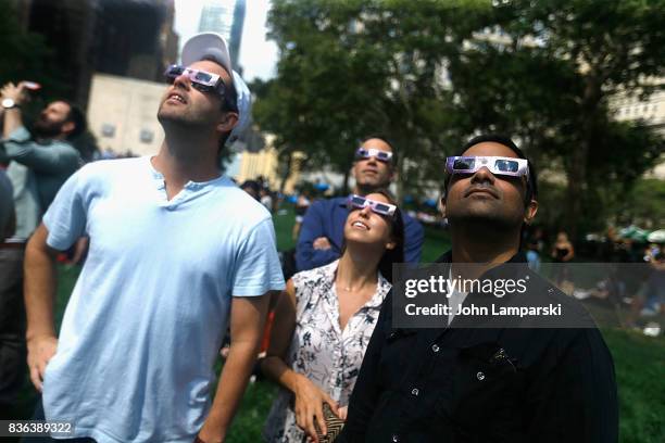 People view the solar eclipse at Battery Park on August 21, 2017 in New York City.