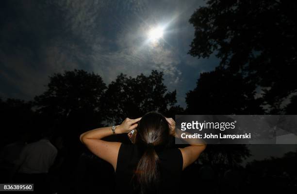 Woman views the solar eclipse at Battery Park on August 21, 2017 in New York City.