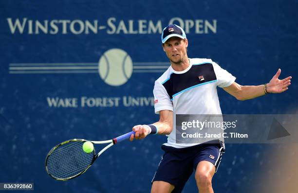 Andreas Seppi of Italy returns a shot from Janko Tipsarevic of Serbia during the third day of the Winston-Salem Open at Wake Forest University on...