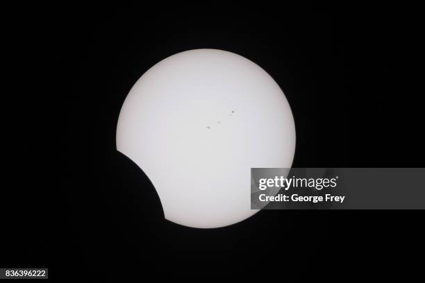 The sun is partially eclipsed in the second phase of a total eclipse in Grand Teton National Park on August 21, 2017 outside Jackson, Wyoming....