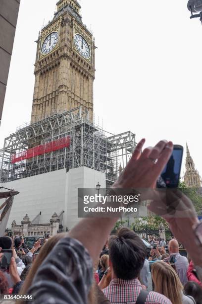 People gather at the base of Elizabeth Tower to listen to the final chimes of Big Ben ahead of a four-year renovation plan, on August 21, 2017 in...