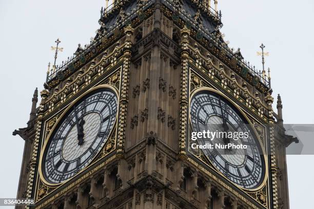 People gather at the base of Elizabeth Tower to listen to the final chimes of Big Ben ahead of a four-year renovation plan, on August 21, 2017 in...