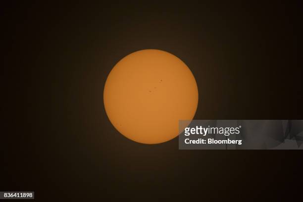The sun is seen prior to the start of a solar eclipse from the campus of Southern Illinois University in Carbondale, Illinois, U.S., on Monday, Aug....
