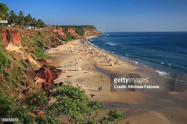 india, kerala, varkala, beach at sunset - kerala surf stock pictures, royalty-free photos & images