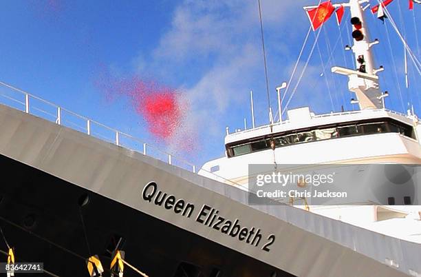 Planes drop a million poppies over The Queen Elizabeth II at Eleven O'Clock on Armistice Day, ahead of its final voyage to Dubai on November 11, 2008...