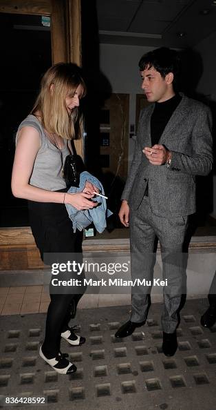 Mark Ronson is seen smoking a cigarette with a mystery girl on... News ...