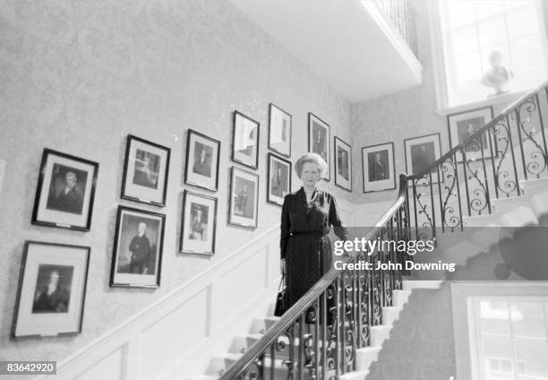 British prime minister Margaret Thatcher on the staircase at Number 10, Downing Street, circa 1985.