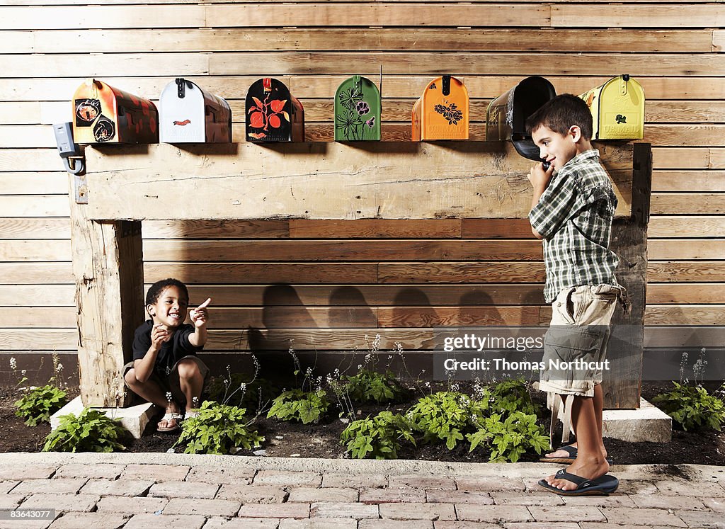 Kids playing by mailboxes