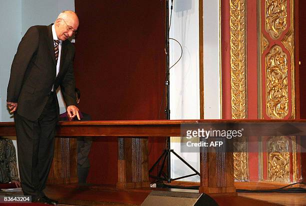 Switzerland's President Pascal Couchepin taps the table on which the 1923 Treaty of Lausanne that settled the borders of modern-day Turkey 85-years...