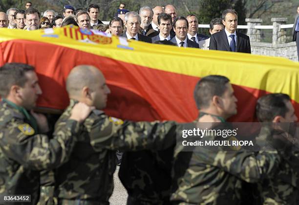 Spanish soldiers carry the coffins of Ruben Alonso Rios and Juan Andres Suarez Garcia, the two Spanish soldiers who were killed on November 9, 2008...