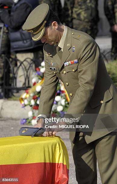 Spanish Prince Felipe places medals on the coffins of Ruben Alonso Rios and Juan Andres Suarez Garcia, the two Spanish soldiers who were killed on...