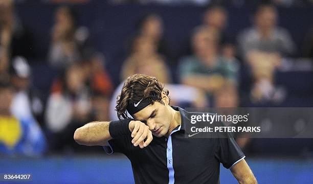 Roger Federer of Switzerland reacts during the final set against Gilles Simon of France in their singles match on the second day of the ATP Masters...