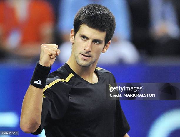 Novak Djokovic of Serbia celebrates winning match point over Nikolay Davydenko of Russia in their men's singles match on the third day of the ATP...