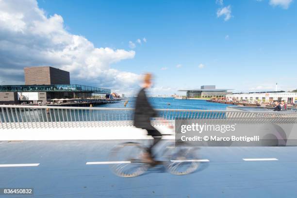 riding bycicle in copenhagen, denmark. - copenhagen cycling stock pictures, royalty-free photos & images