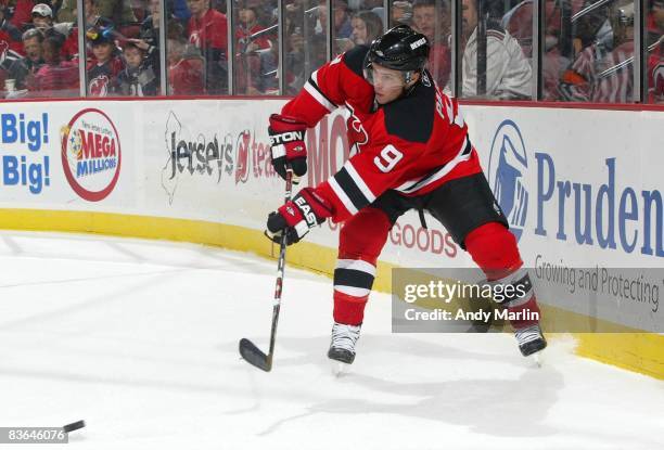 Zach Parise of the New Jersey Devils passes the puck against the Edmonton Oilers at the Prudential Center on November 9, 2008 in Newark, New Jersey.