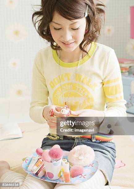 makeup scene - woman smiling facing down stock pictures, royalty-free photos & images